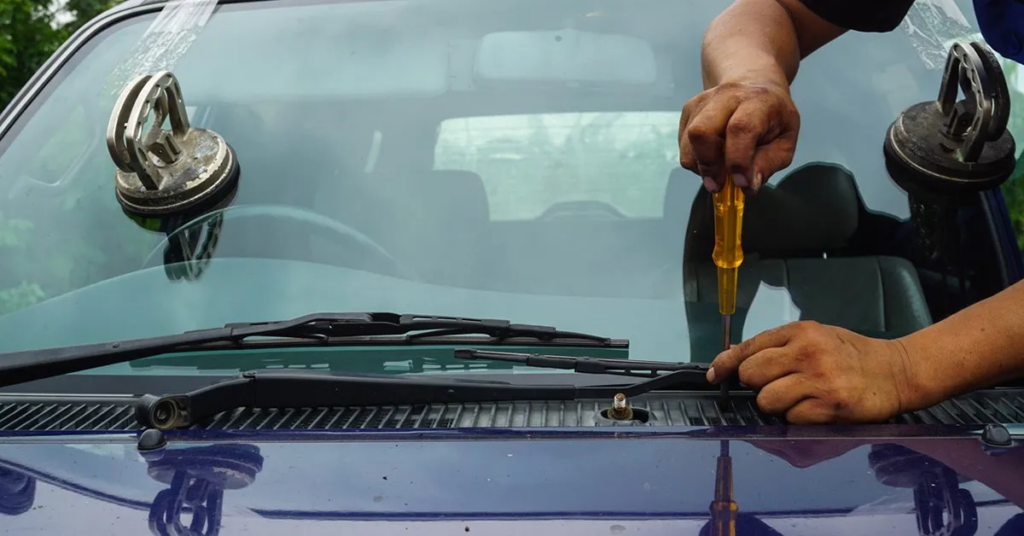 a professional replacing windshield