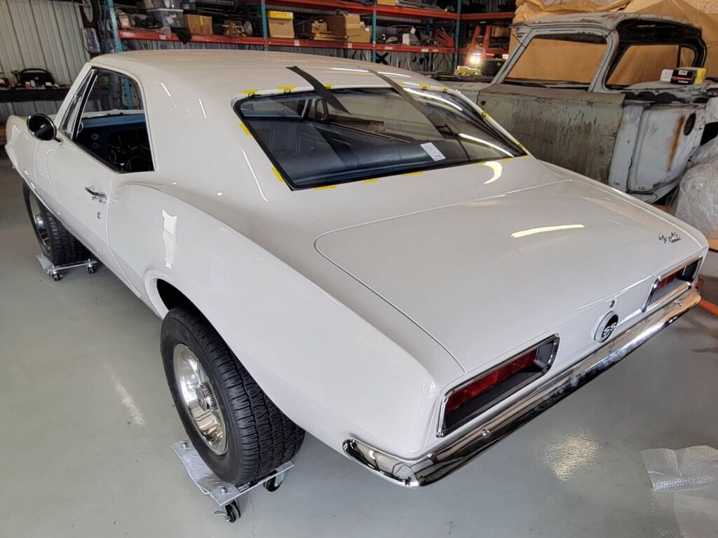 White classic car with newly replaced back window